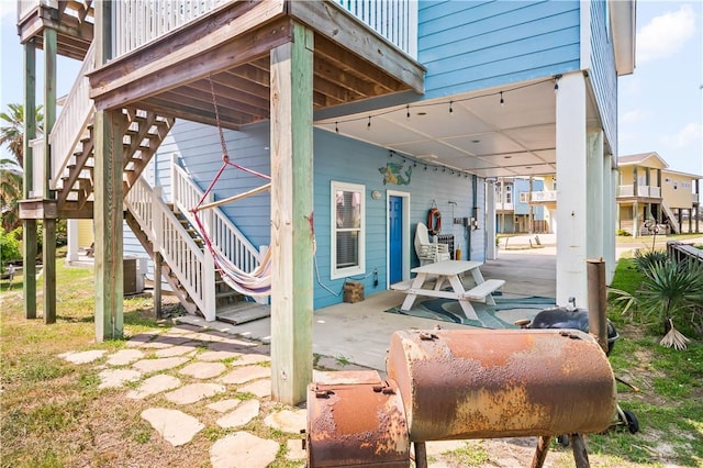 678 Anchor Dr, Port Aransas, TX 78373 - view of patio with stairs and central AC