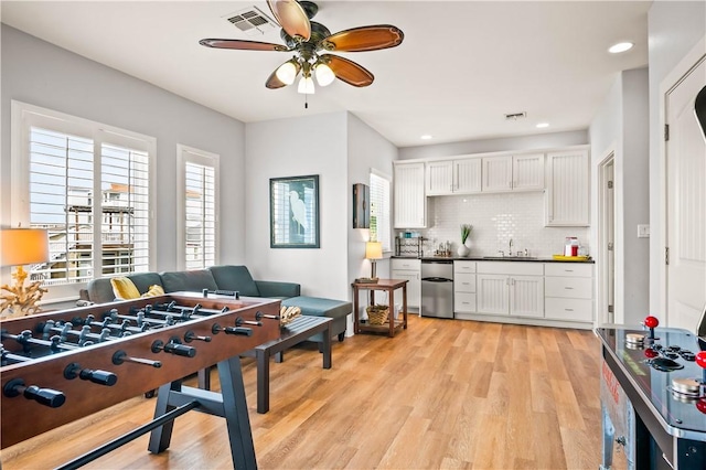 678 Anchor Dr, Port Aransas, TX 78373 - playroom featuring a ceiling fan, light wood-type flooring, a sink, and recessed lighting