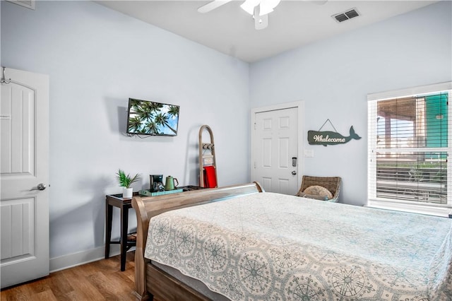 678 Anchor Dr, Port Aransas, TX 78373 - bedroom featuring wood finished floors, baseboards, and ceiling fan