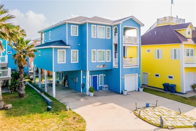 678 Anchor Dr, Port Aransas, TX 78373 - coastal inspired home featuring concrete driveway, a garage, and a carport