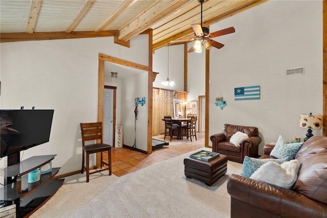 tiled living room featuring beam ceiling, ceiling fan, and wood ceiling