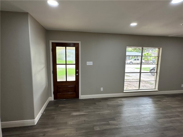 entryway with dark hardwood / wood-style flooring