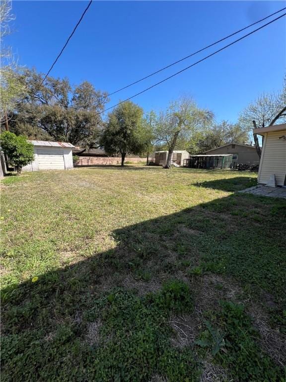 view of yard with an outbuilding and a storage shed