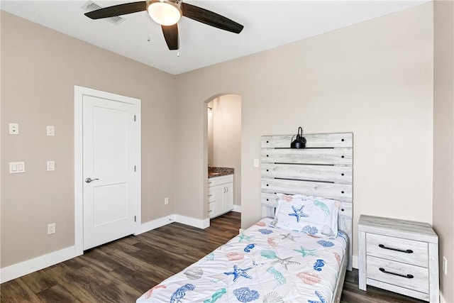 110 Keewaydin Ln, Port Aransas, TX 78373 - bedroom featuring arched walkways, dark wood-style floors, and ceiling fan