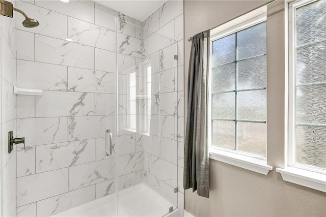 110 Keewaydin Ln, Port Aransas, TX 78373 - bathroom with a stall shower and healthy amount of natural light