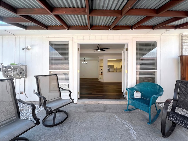 property entrance featuring a patio and ceiling fan