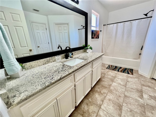 bathroom featuring vanity, tile patterned floors, and shower / tub combo with curtain