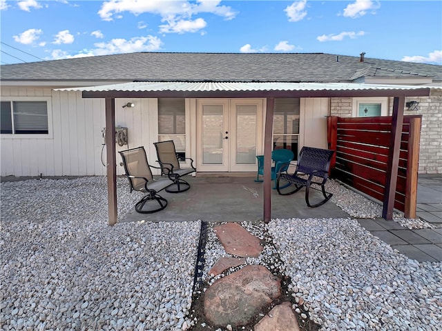 rear view of house featuring french doors and a patio area