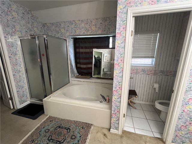 bathroom featuring toilet, separate shower and tub, and tile patterned floors