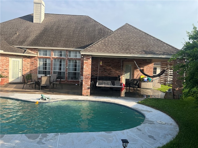 view of pool featuring a patio