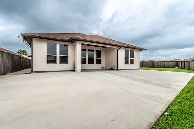 8022 Calgary Dr, Corpus Christi, TX 78414 - rear view of property with a fenced backyard, a patio, and stucco siding