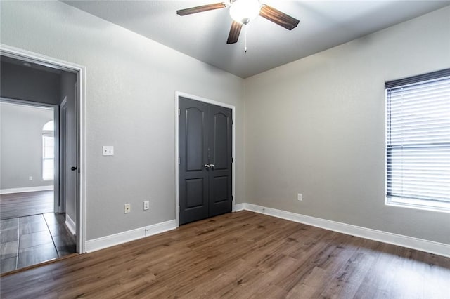 8022 Calgary Dr, Corpus Christi, TX 78414 - unfurnished bedroom with wood finished floors and a ceiling fan