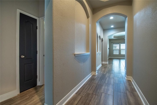 8022 Calgary Dr, Corpus Christi, TX 78414 - corridor with arched walkways, dark wood-type flooring, a textured wall, and recessed lighting