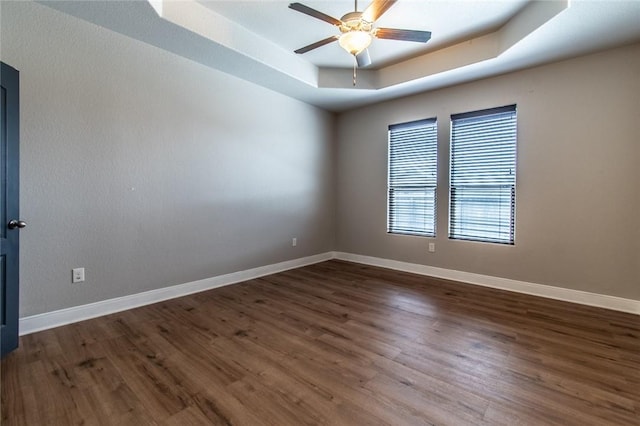 8022 Calgary Dr, Corpus Christi, TX 78414 - spare room featuring a tray ceiling, a ceiling fan, and wood finished floors