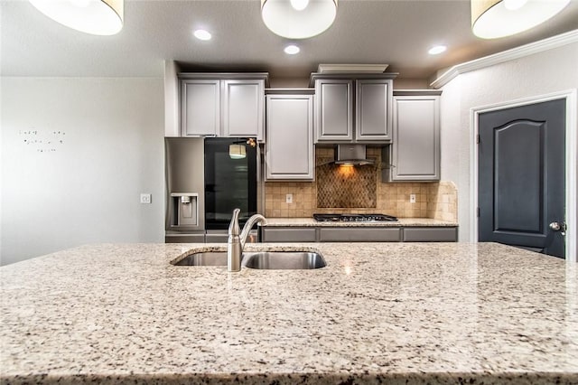 8022 Calgary Dr, Corpus Christi, TX 78414 - kitchen featuring stainless steel appliances, a center island with sink, tasteful backsplash, light stone countertops, and recessed lighting
