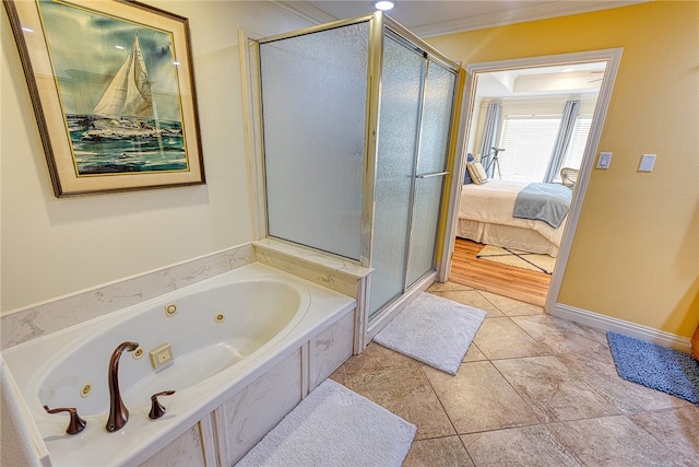 bathroom with tile patterned floors, crown molding, and independent shower and bath