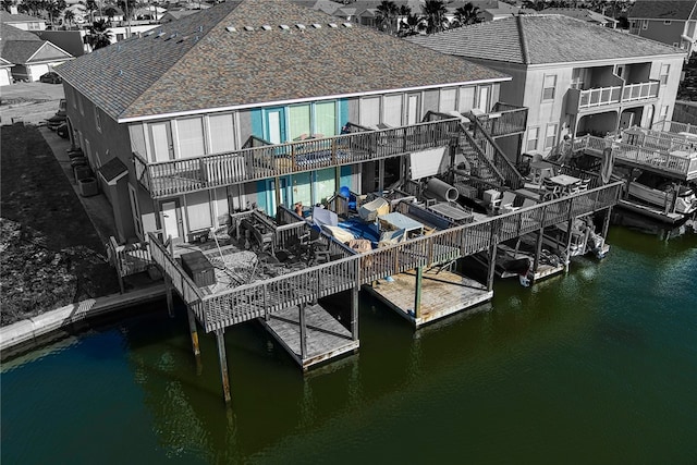 dock area with a balcony and a pool side deck