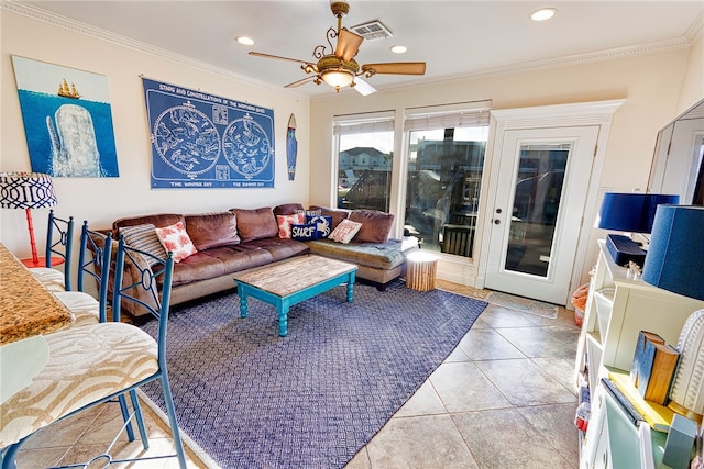 tiled living room with ornamental molding and ceiling fan