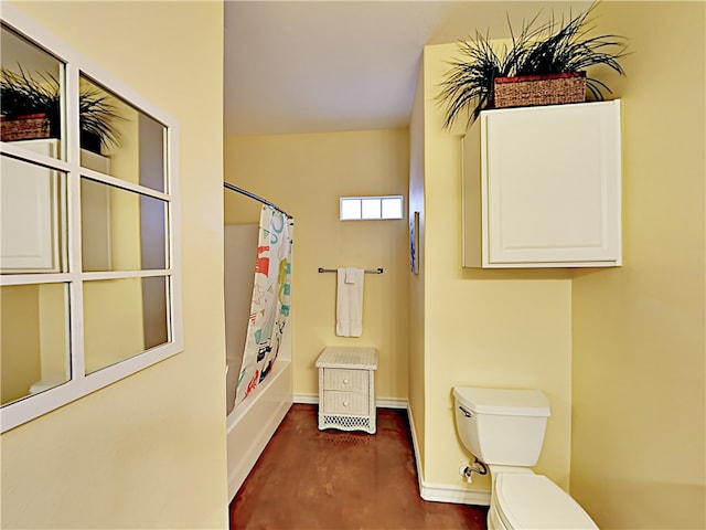 bathroom with shower / tub combo with curtain and toilet