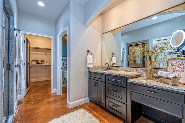 4609 Tuscan Way, Corpus Christi, TX 78410 - full bath with vanity, finished concrete flooring, a shower stall, a walk in closet, and recessed lighting
