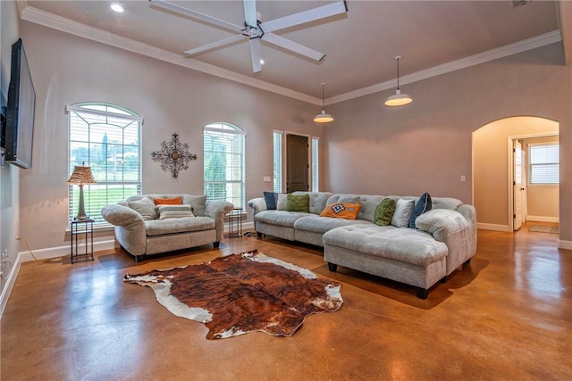 4609 Tuscan Way, Corpus Christi, TX 78410 - living area with concrete floors, arched walkways, ceiling fan, and ornamental molding