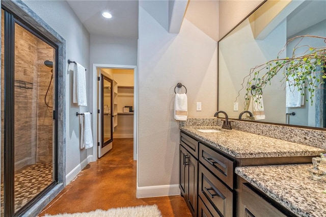 4609 Tuscan Way, Corpus Christi, TX 78410 - full bathroom featuring concrete flooring, a shower stall, vanity, a walk in closet, and recessed lighting