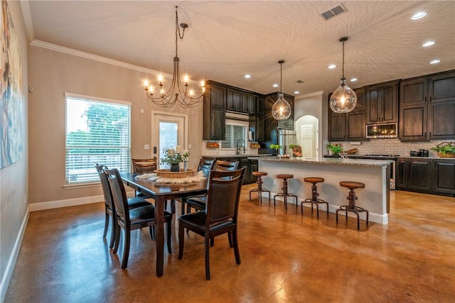 4609 Tuscan Way, Corpus Christi, TX 78410 - dining area with finished concrete flooring, recessed lighting, ornamental molding, a chandelier, and arched walkways