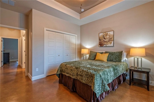 4609 Tuscan Way, Corpus Christi, TX 78410 - bedroom featuring finished concrete flooring, a closet, and a tray ceiling