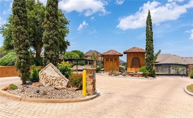 4609 Tuscan Way, Corpus Christi, TX 78410 - mediterranean / spanish home featuring a gate, stucco siding, a tile roof, and curved driveway