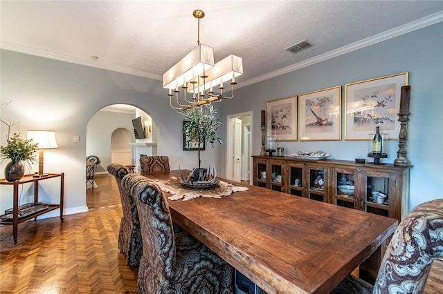 261 Louisiana Ave, Corpus Christi, TX 78404 - dining room with arched walkways, a chandelier, ornamental molding, and baseboards