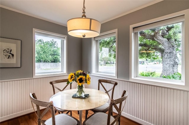 261 Louisiana Ave, Corpus Christi, TX 78404 - dining room featuring dark wood-style flooring, crown molding, and wainscoting