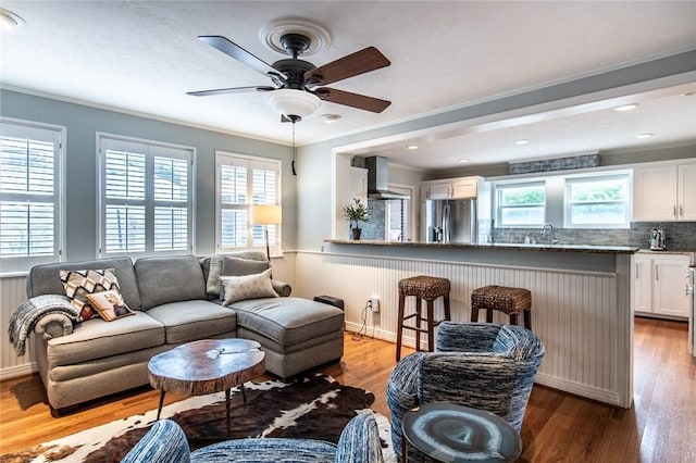 261 Louisiana Ave, Corpus Christi, TX 78404 - living room with wood finished floors, a ceiling fan, wainscoting, and ornamental molding
