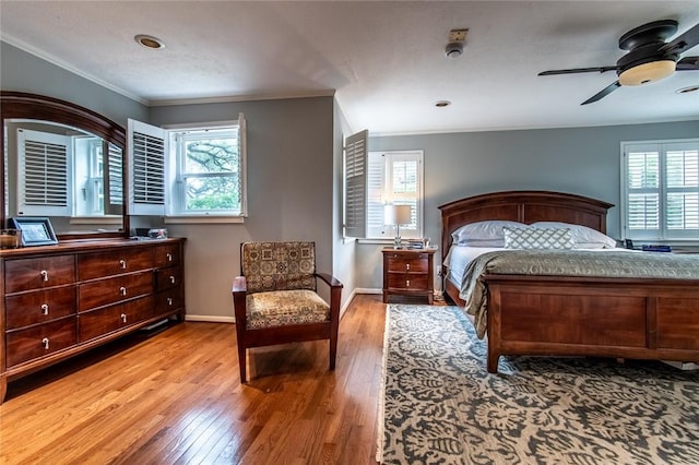 261 Louisiana Ave, Corpus Christi, TX 78404 - bedroom with multiple windows, wood finished floors, crown molding, and baseboards