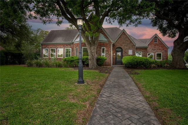 261 Louisiana Ave, Corpus Christi, TX 78404 - tudor home featuring brick siding and a front lawn