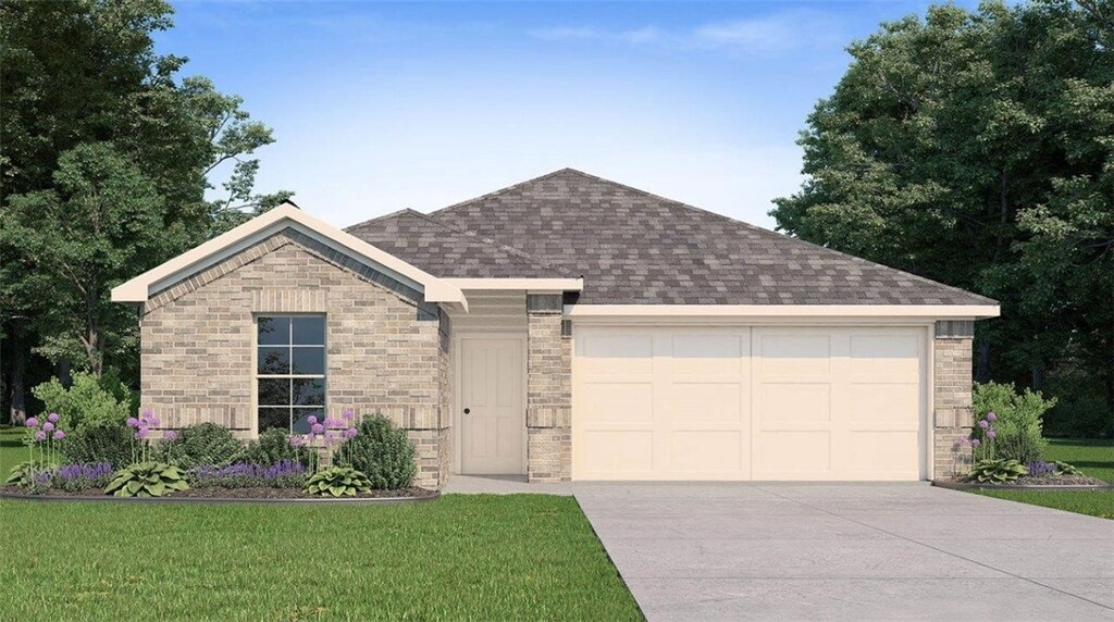 view of front of home with a garage and a front yard