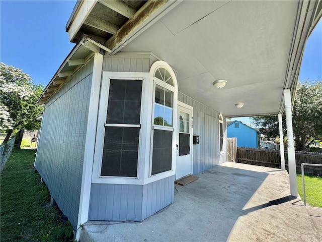 view of patio featuring fence