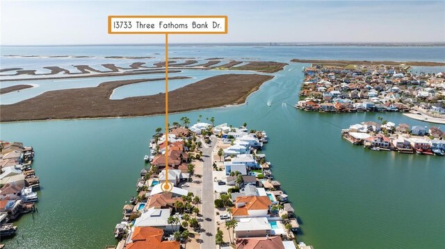 aerial view featuring a residential view and a water view