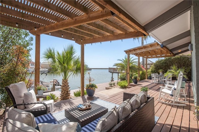 deck with an outdoor hangout area, outdoor dining space, a pergola, and a water view