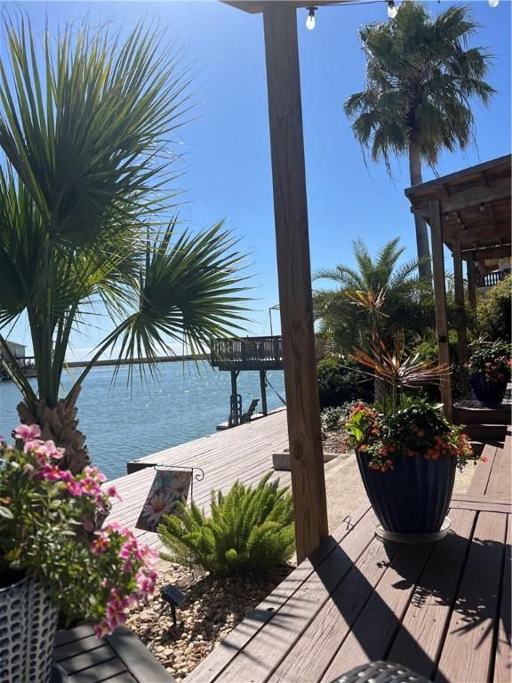 wooden terrace with a water view