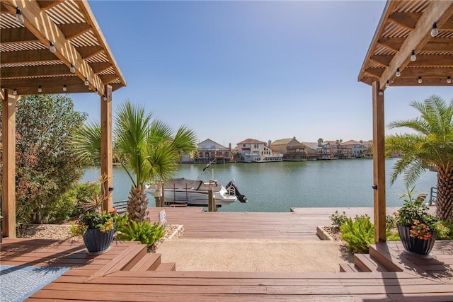 view of dock featuring a pergola and a water view