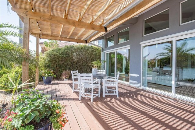 deck featuring outdoor dining area