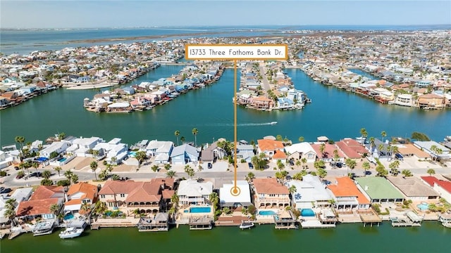 bird's eye view with a residential view and a water view