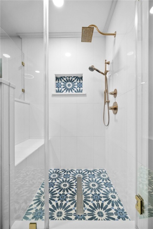 bathroom featuring an enclosed shower