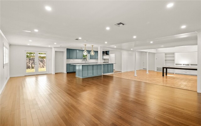 unfurnished living room featuring light hardwood / wood-style flooring