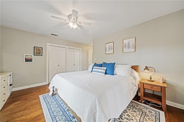 149 Rossiter St, Corpus Christi, TX 78411 - bedroom with multiple closets, baseboards, wood finished floors, and a ceiling fan