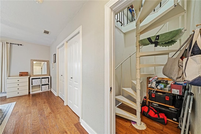 149 Rossiter St, Corpus Christi, TX 78411 - hallway with wood finished floors and stairway