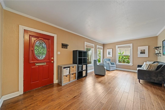 149 Rossiter St, Corpus Christi, TX 78411 - living area with crown molding, wood finished floors, and baseboards