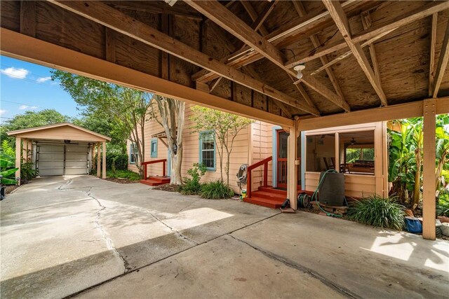 149 Rossiter St, Corpus Christi, TX 78411 - view of patio / terrace with an outdoor structure, a detached garage, and entry steps
