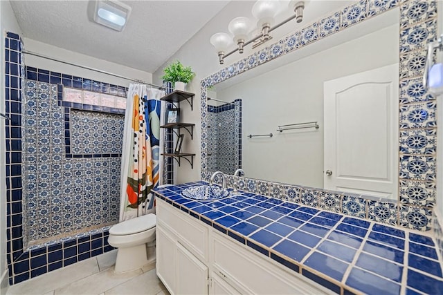 149 Rossiter St, Corpus Christi, TX 78411 - full bathroom featuring tile patterned floors, toilet, a tile shower, and vanity