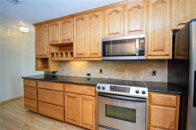 kitchen featuring light wood finished floors, backsplash, baseboards, stainless steel appliances, and open shelves